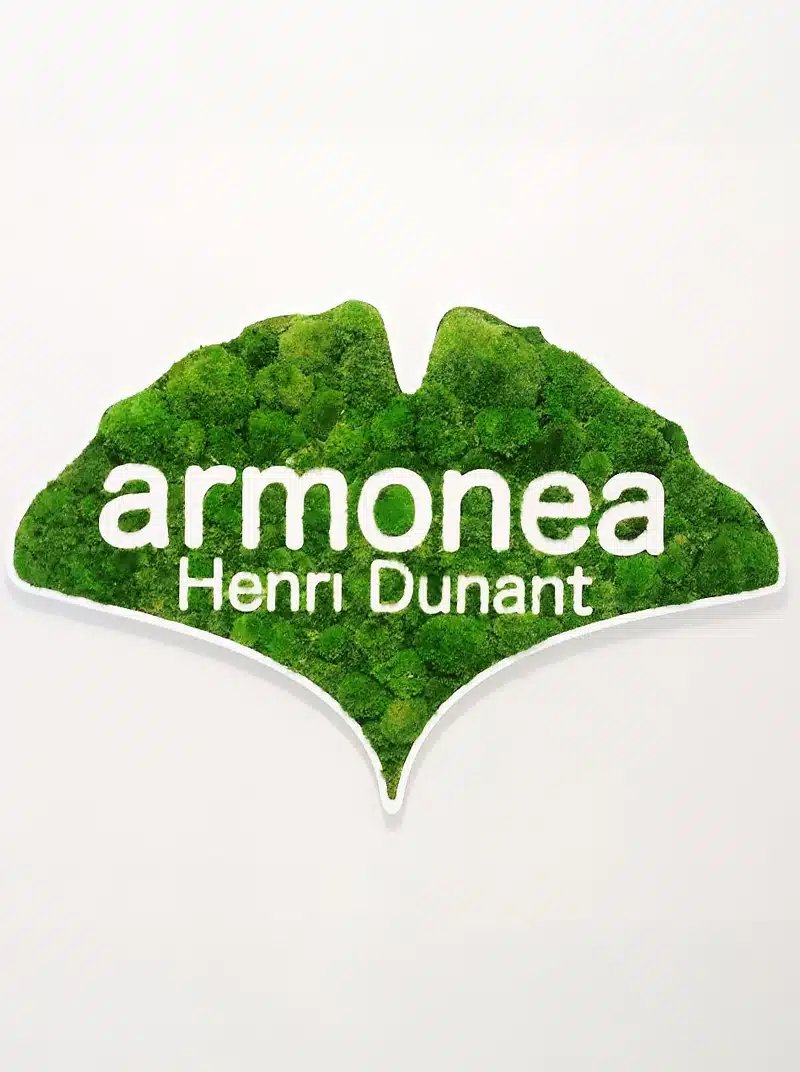 Armonea Henri Dunant logo on green background