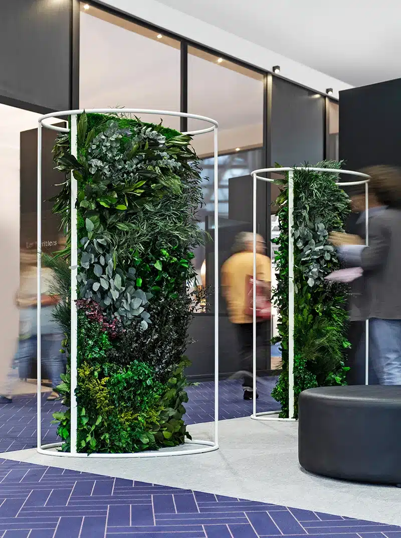 Vertical green plant installation in modern interior space.